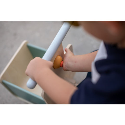 Kid playing PlanToys Delivery Bike - Orchard Collection