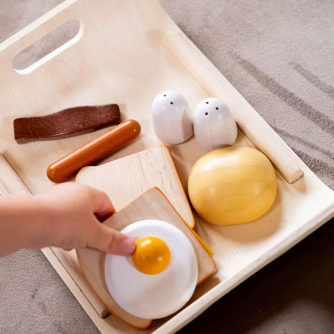 Kid playing PlanToys Breakfast Menu