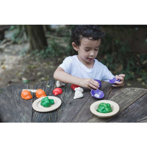 Kid playing PlanToys 5 Colors Veggie Set