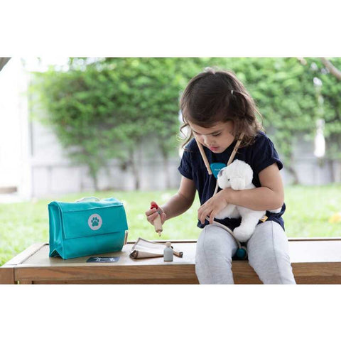 Kid playing PlanToys Vet Set