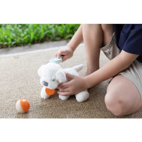 Kid playing PlanToys Pet Care Set