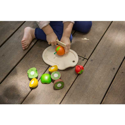 Kid playing PlanToys Assorted Fruit Set