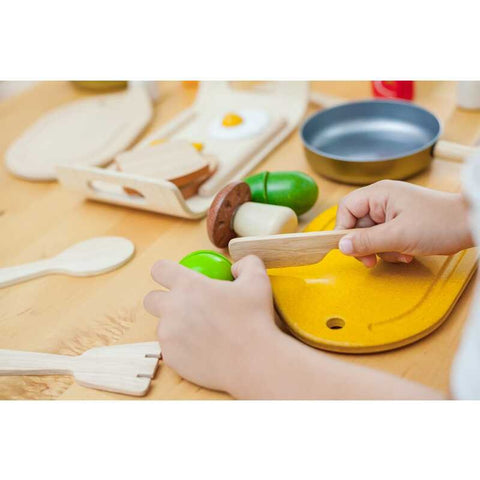 Kid playing PlanToys Assorted Vegetables Set