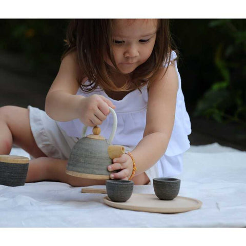 Kid playing PlanToys Classic Tea Set