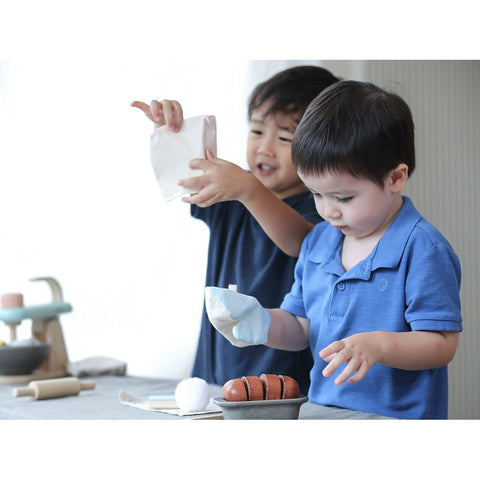 Kid playing PlanToys Bread Loaf Set