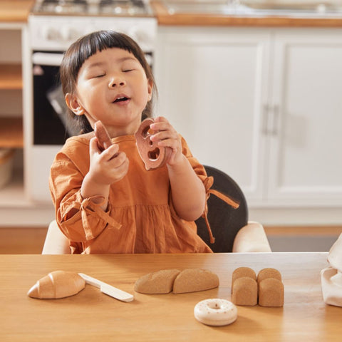 Kid playing PlanToys Bread Set