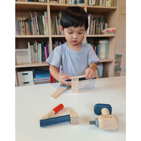 Kid playing PlanToys Handy Carpenter Set