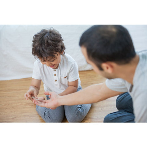 Kid playing PlanToys Seasonal Bingo