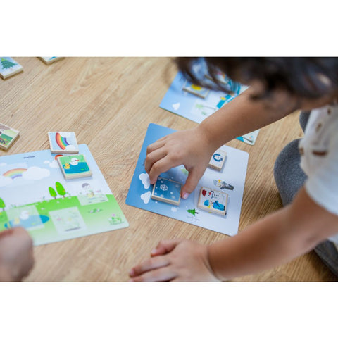 Kid playing PlanToys Seasonal Bingo