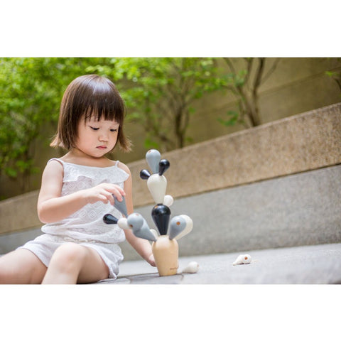 Kid playing PlanToys Balancing Cactus- Special Edition