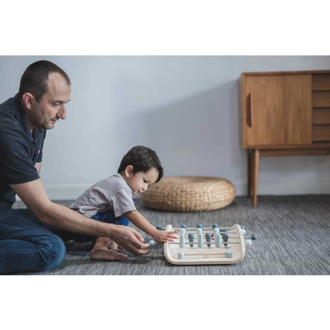 Kid playing PlanToys Soccer