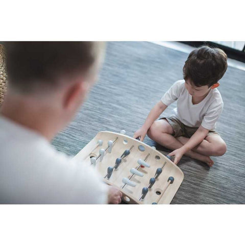 Kid playing PlanToys Soccer