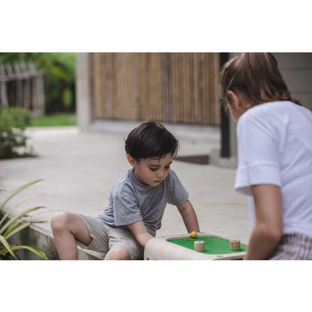 Kid playing PlanToys Magnetic Board Game