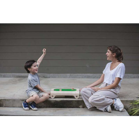 Kid playing PlanToys Magnetic Board Game