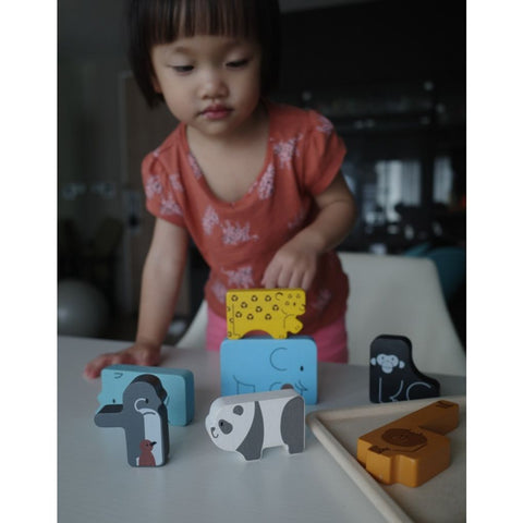 Kid playing PlanToys Animal Puzzle Game