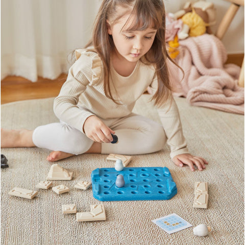 Kid playing PlanToys Finding Penguin Game