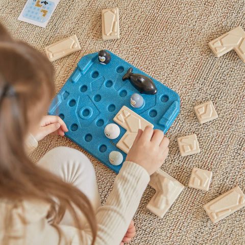 Kid playing PlanToys Finding Penguin Game