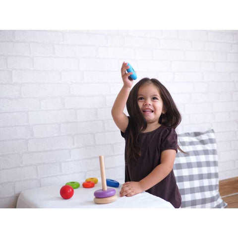 Kid playing PlanToys Stacking Ring