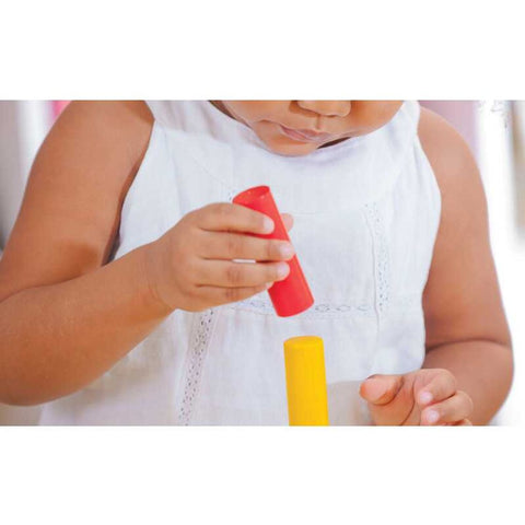 Kid playing PlanToys Geometric Peg Board