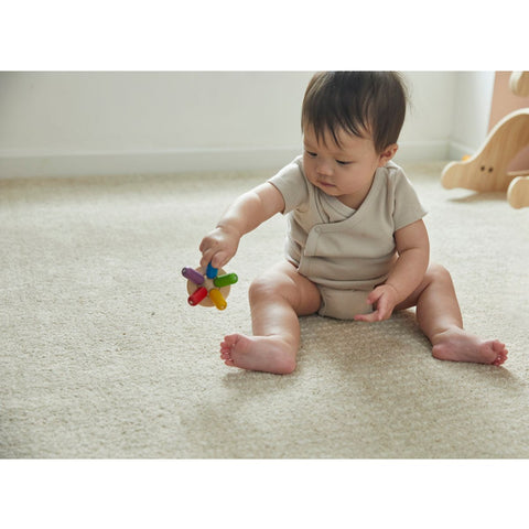 Kid playing PlanToys Flexi Jellyfish