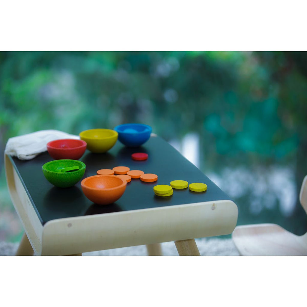 Kid playing PlanToys Sort & Count Cups