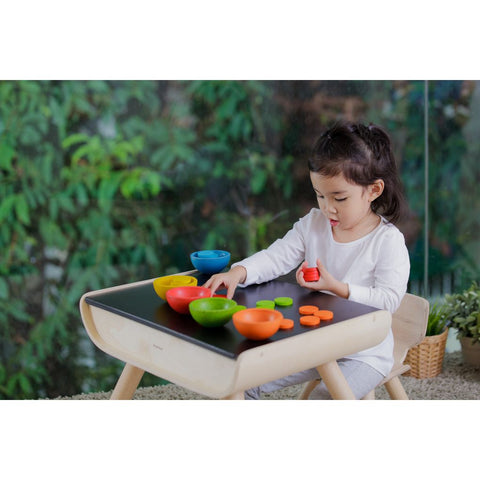 Kid playing PlanToys Sort & Count Cups