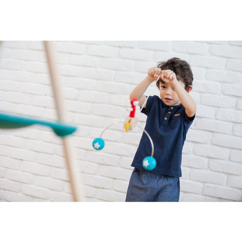 Kid playing PlanToys Riding Acrobat