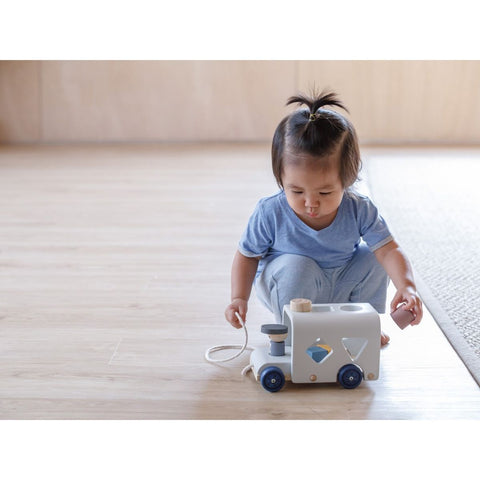 Kid playing PlanToys Sorting Bus - Orchard Series