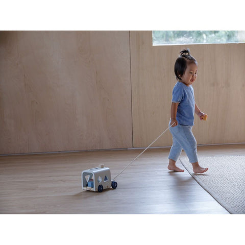 Kid playing PlanToys Sorting Bus - Orchard Series