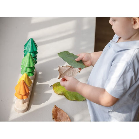 Kid playing PlanToys Sort & Count Trees