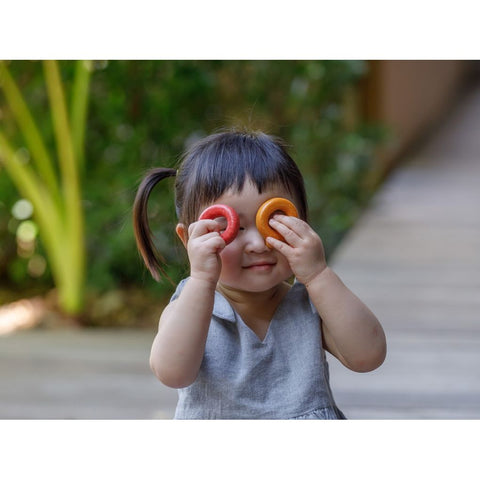 Kid playing PlanToys Upper Case Alphabet