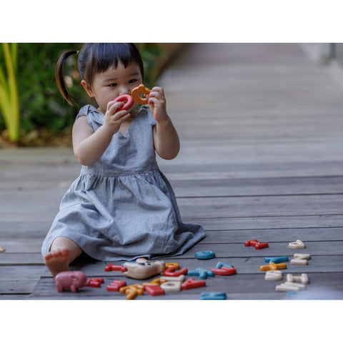 Kid playing PlanToys Upper Case Alphabet