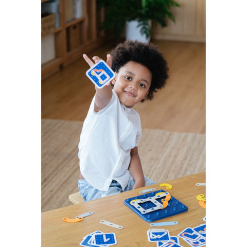 Kid playing PlanToys Creative Board