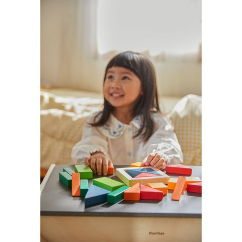 Kid playing PlanToys Fraction Blocks - Unit Plus