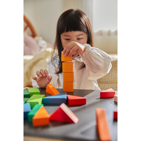 Kid playing PlanToys Fraction Blocks - Unit Plus