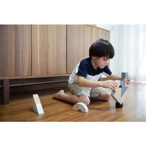 Kid playing PlanToys Twisted Blocks