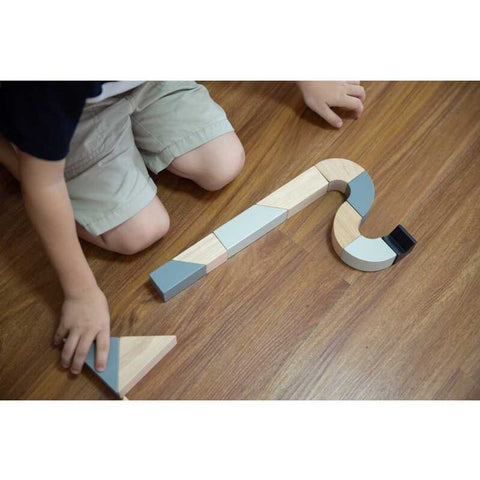 Kid playing PlanToys Twisted Blocks