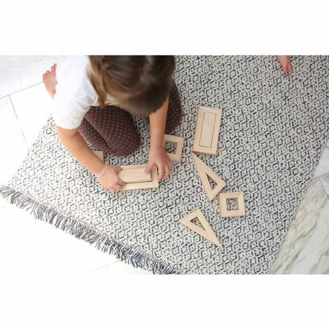 Kid playing PlanToys Hollow Blocks