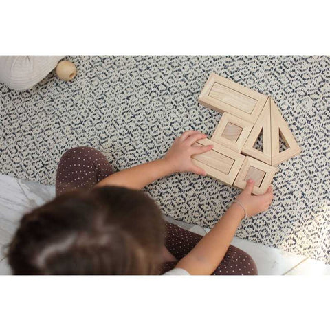 Kid playing PlanToys Hollow Blocks