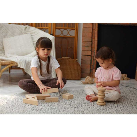 Kid playing PlanToys Hollow Blocks