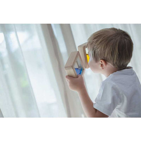 Kid playing PlanToys Water Blocks