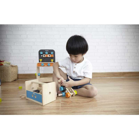 Kid playing PlanToys Construction Set