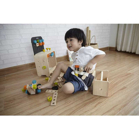 Kid playing PlanToys Construction Set