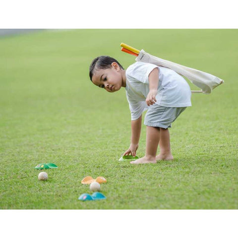 Kid playing PlanToys Mini Golf - Full Set