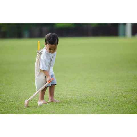 Kid playing PlanToys Mini Golf - Full Set