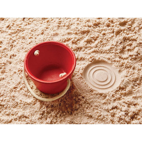 Kid playing PlanToys Sand Play Set