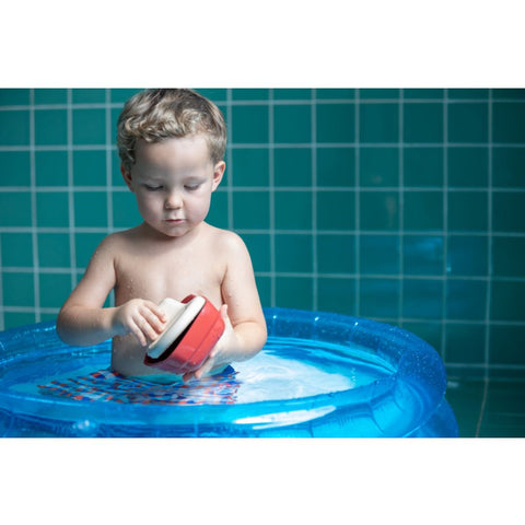 Kid playing PlanToys Cargo Ship