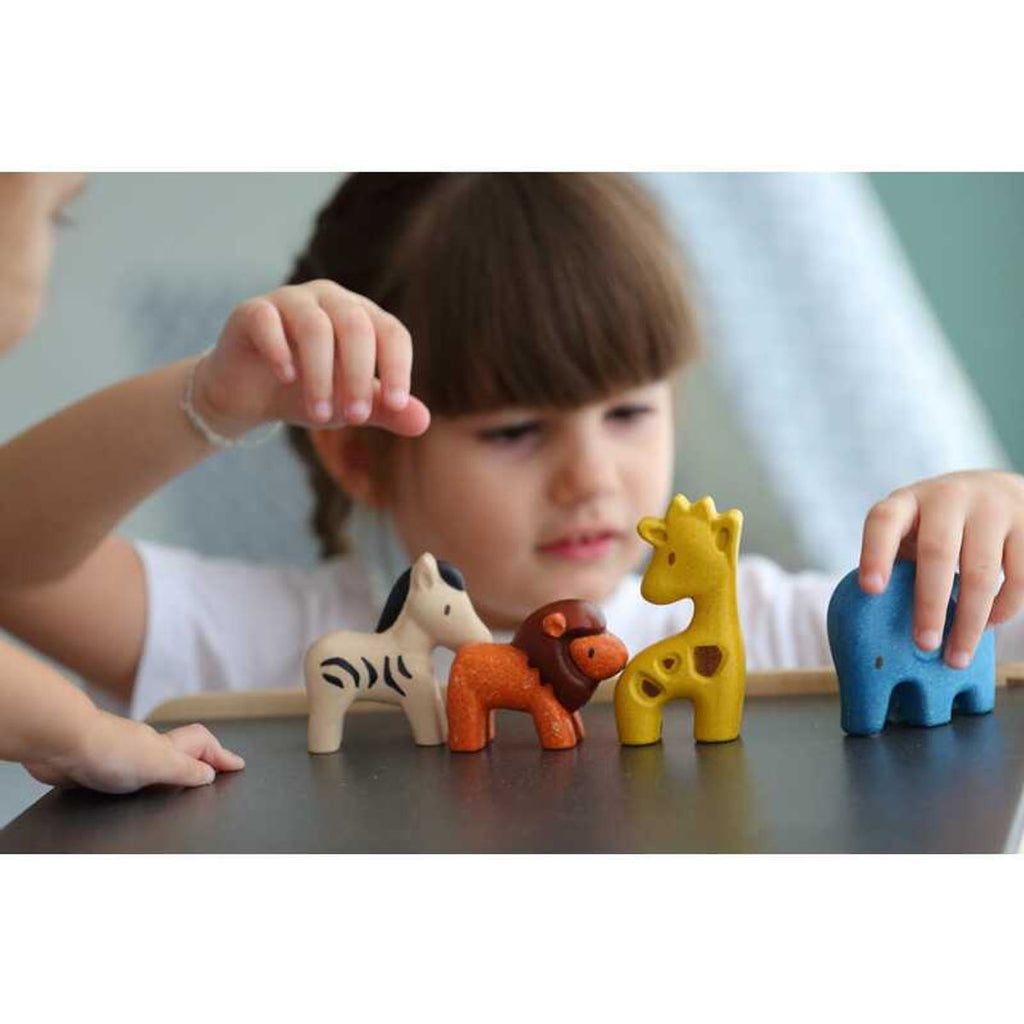 Kid playing PlanToys Wild Animals Set