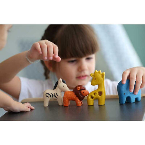 Kid playing PlanToys Wild Animals Set