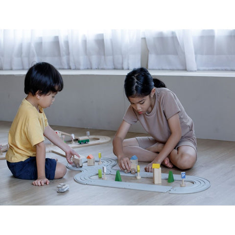 Kid playing PlanToys Rubber Road & Rail Set - Medium